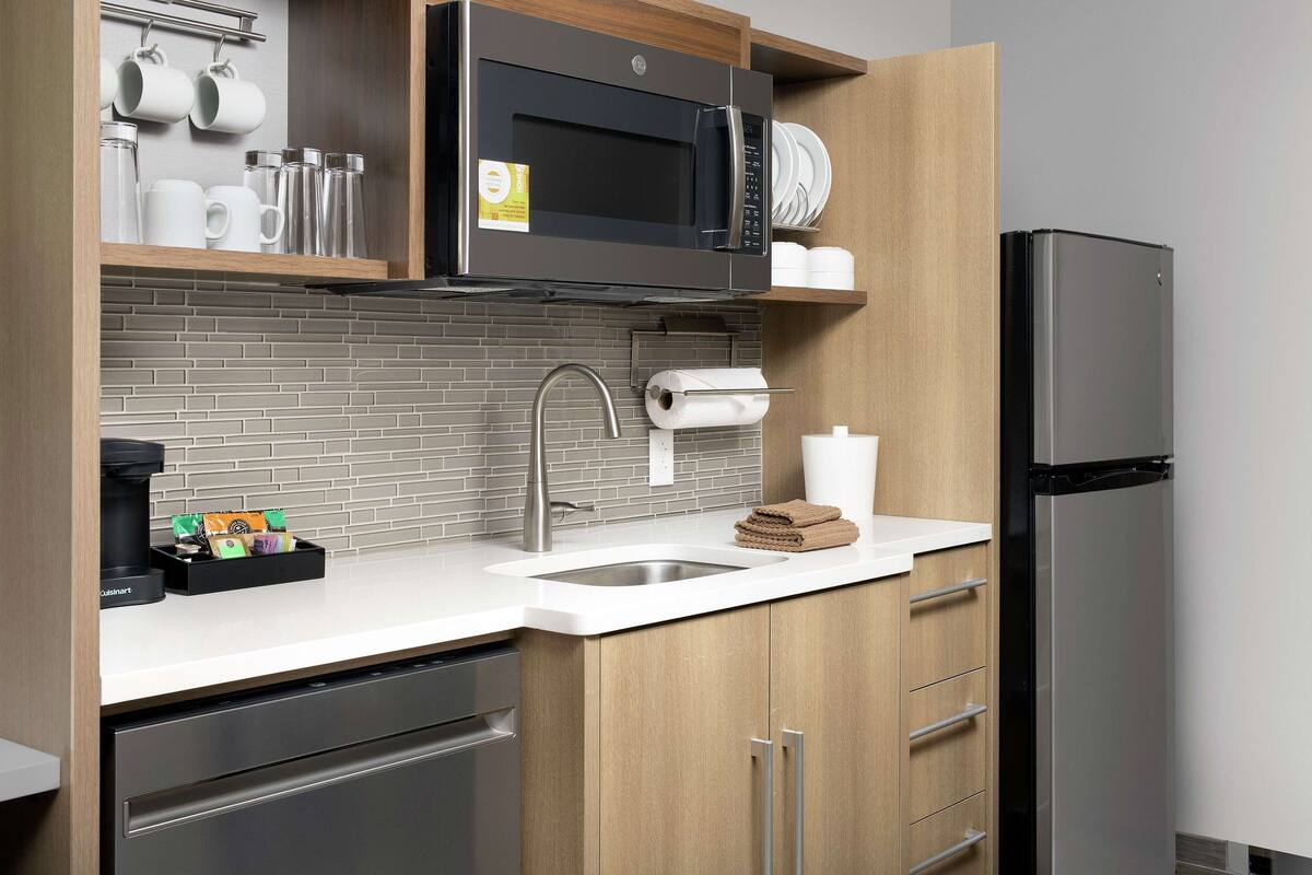 full-sized fridge, microwave, dishwasher, coffee/tea maker