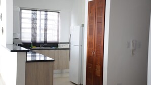 Comfort Apartment, City View | Private kitchen | Coffee/tea maker, full-sized fridge, microwave, oven - Two Bedrooms Apt Los Prados-TERRACE-GYM (Santo Domingo)