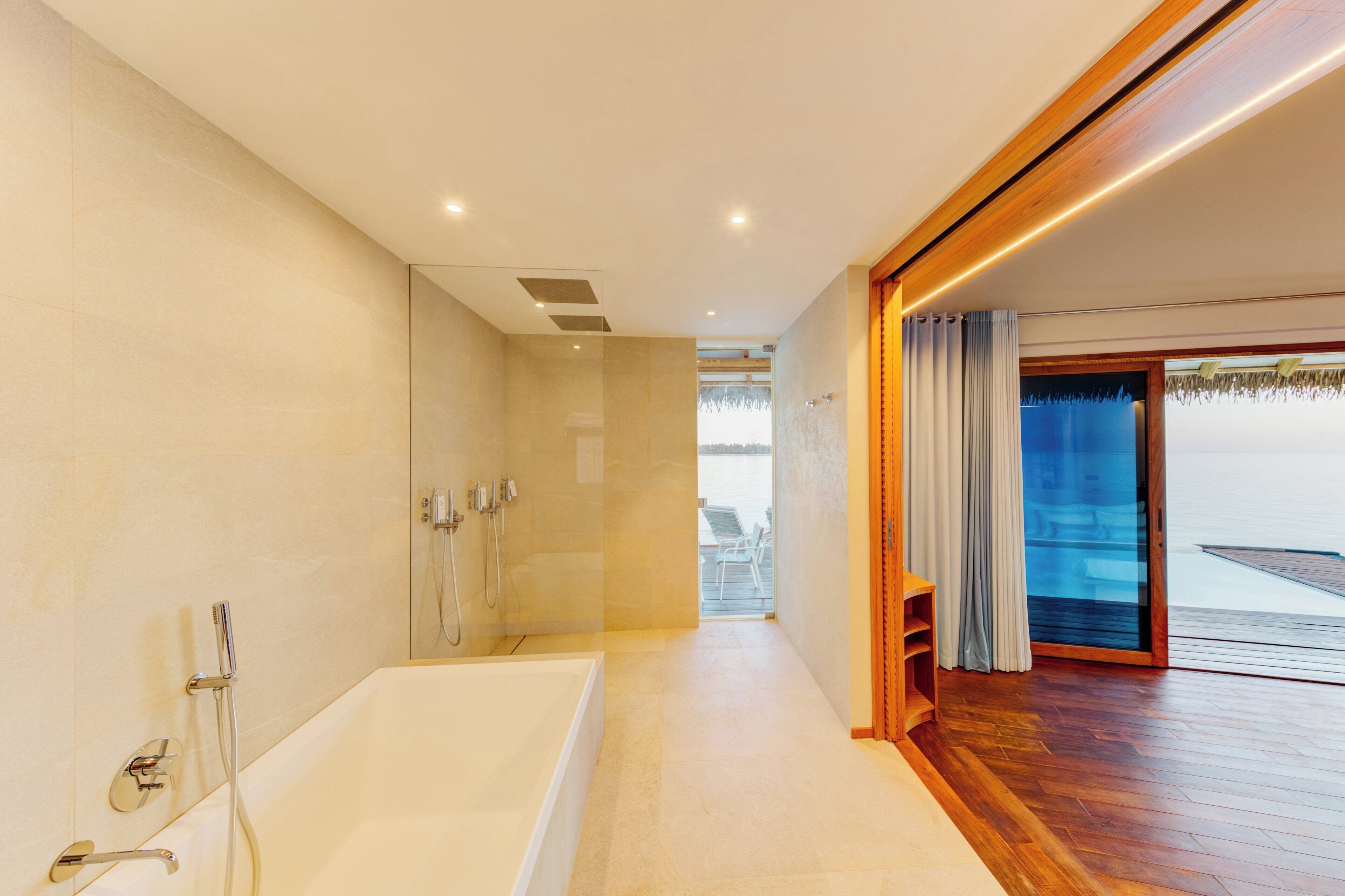 water suite with pool | bathroom | shower, eco-friendly toiletries, hair dryer, bathrobes