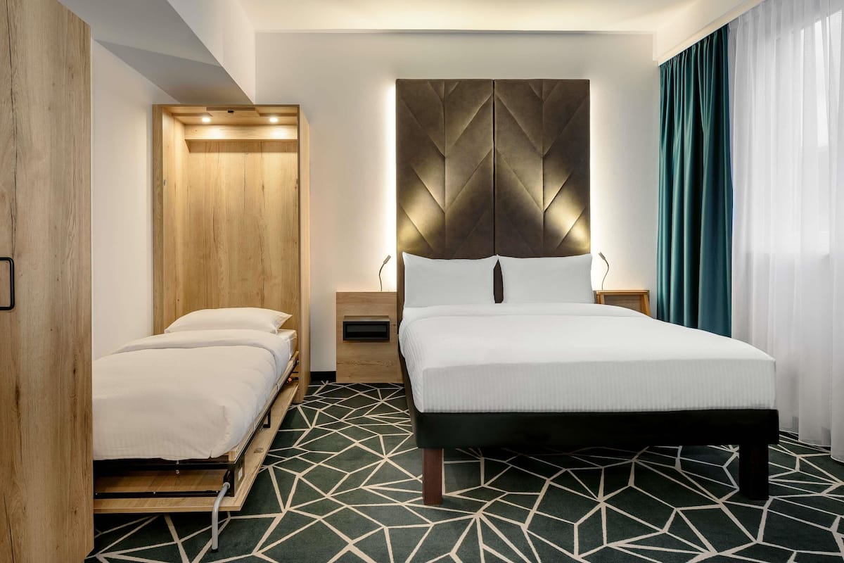 Family Room, Multiple Beds (Modern with Double bed and Sofa Bed) | 1 bedroom, in-room safe, desk, blackout drapes