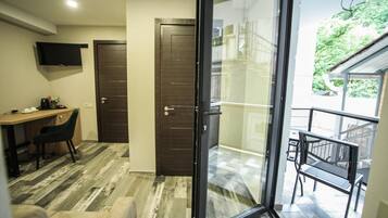 Family Room, Balcony | Hypo-allergenic bedding, minibar, in-room safe, desk