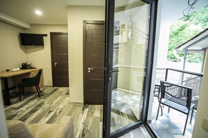 Family Room, Balcony | Hypo-allergenic bedding available, minibar, in-room safe, desk
