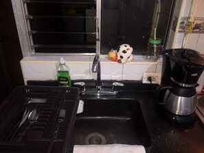 Microwave, dishwasher, coffee/tea maker, cookware/dishes/utensils