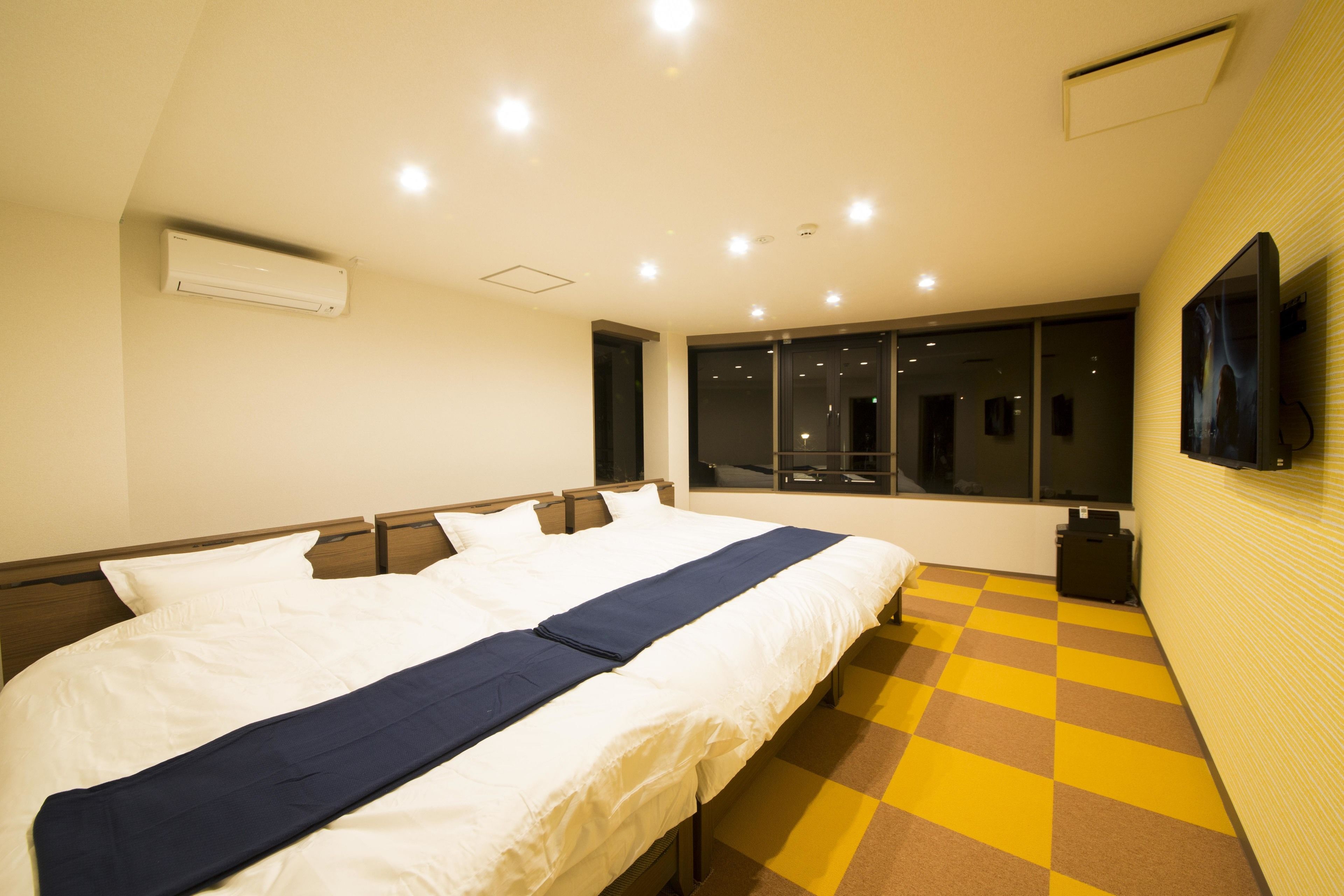 Room, 3 Large Twin Beds | Premium bedding, in-room safe, soundproofing, iron/ironing board