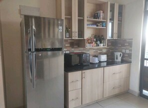 Fridge, microwave, stovetop, electric kettle