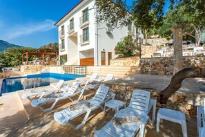 Seasonal outdoor pool, pool loungers