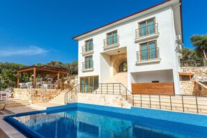 Seasonal outdoor pool, pool loungers