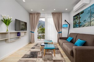 Deluxe Apartment, Garden View | Minibar, in-room safe, soundproofing, free WiFi