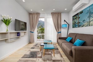 Appartement Deluxe, vue sur le jardin | Minibar, coffre-fort, systĂšme dâinsonorisation, accĂšs au Wi-Fi (inclus)