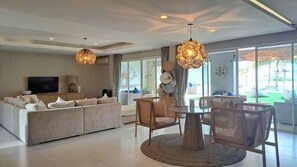 Luxury 7-Bedroom Beachfront Villa | Living area | 55-inch LED TV with satellite channels, TV