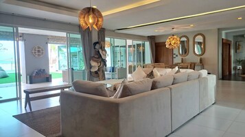 Luxury 7-Bedroom Beachfront Villa | Living area | 55-inch LED TV with satellite channels, TV