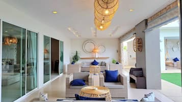 Luxury 7-Bedroom Beachfront Villa | Living area | 55-inch LED TV with satellite channels, TV
