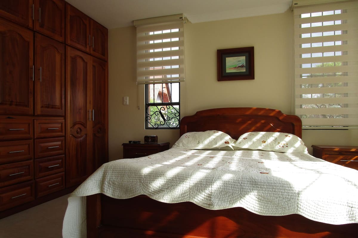 Premium bedding, down comforters, blackout drapes, iron/ironing board