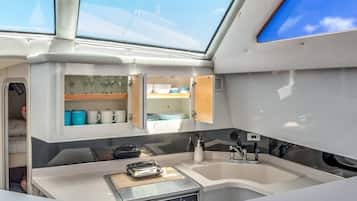 Fridge, microwave, stovetop, coffee/tea maker