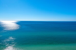 On the beach, sun-loungers