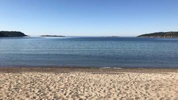 On the beach, sun-loungers, beach towels