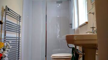 Bathtub, hair dryer, towels, soap