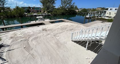 NEW RENTAL!!! Conch Heaven is a four bedroom house on a canal with a dock.