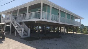 A two-story building with a balcony on the upper floor.
