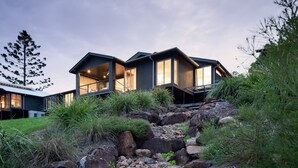 A modern house with large windows and a stone pathway leading to the entrance. - Luxurious retreat in Pullenvale (Pullenvale)
