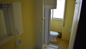 A bathroom with a sink, toilet, and shower. - Still White Beach **** Wonderful room facing the sea (Avola)
