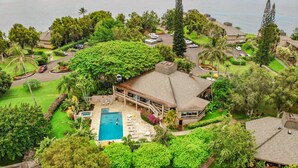 An aerial view of a large house with a swimming pool, surrounded by lush greenery and a view of the sea. - Pali Ke Kua 216 Amazing Panoramic View, idyllic retreat (Pinceville)