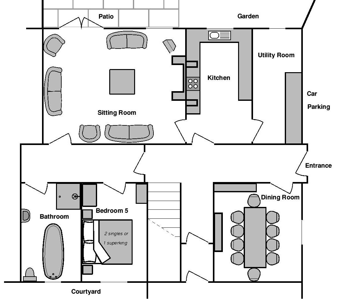 Een plattegrond met terras, zithoek, keuken, bijkeuken, parkeerplaats, entree, eetkamer, badkamer, slaapkamer 5 en een binnenplaats.