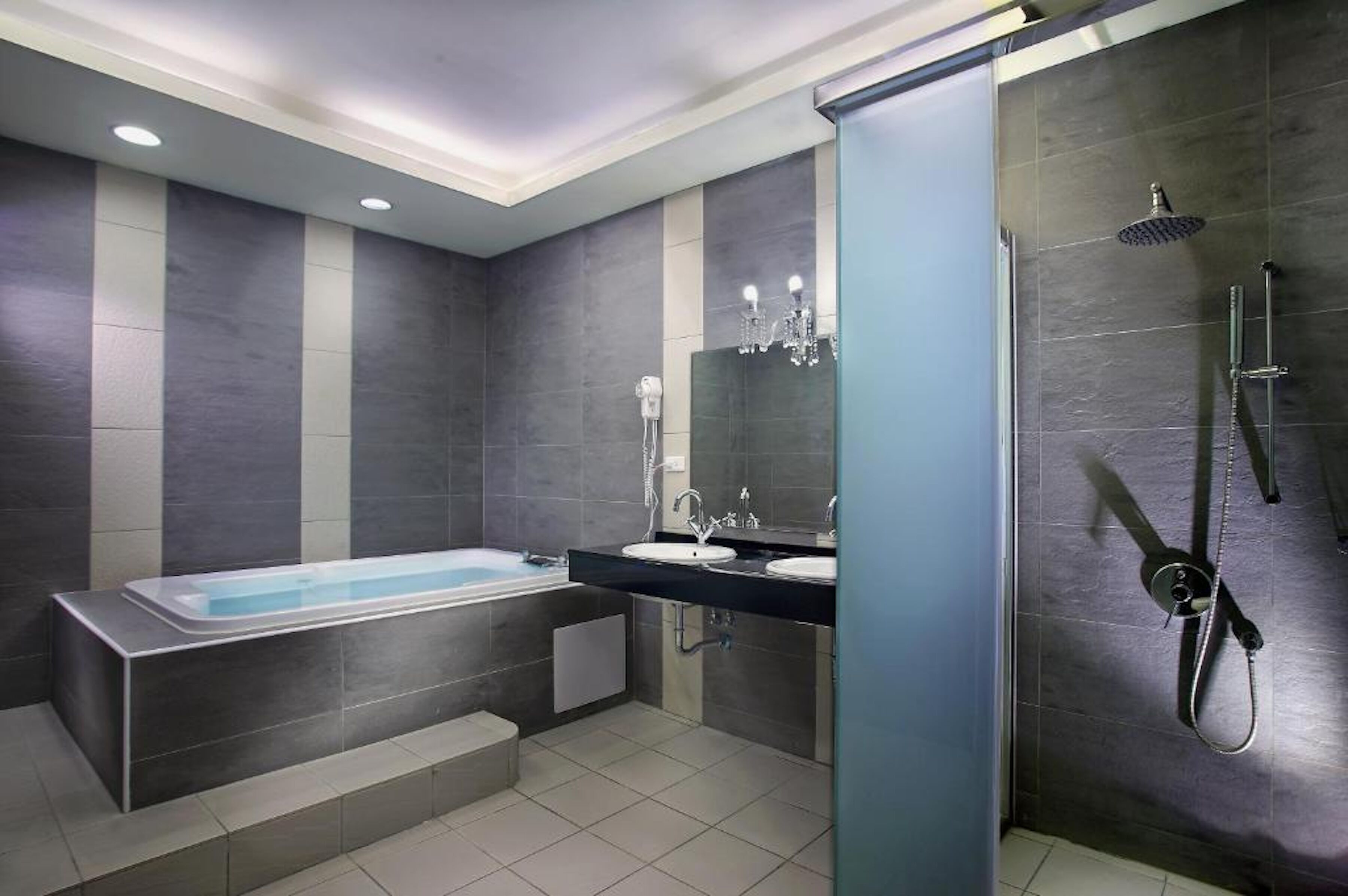 shower, hair dryer, towels, shampoo