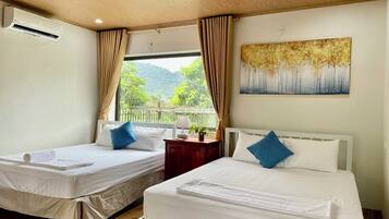 Family Room, Garden View | 1 bedroom, down comforters, Select Comfort beds, desk