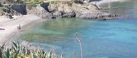 On the beach, sun-loungers