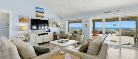 Flat-screen TV, DVD player, books, stereo