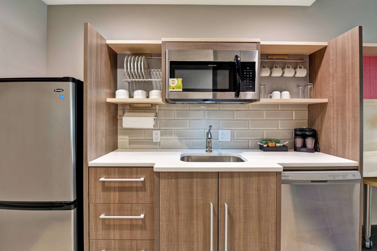 full-sized fridge, microwave, dishwasher, coffee/tea maker