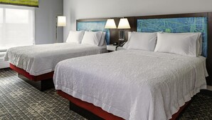 A hotel room with two beds, a nightstand, a lamp, and a large window with a view. - Hampton Inn & Suites Pittsburgh New Stanton (New Stanton)