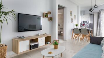 Apartment, 1 Bedroom (E) | Living area | Flat-screen TV, video-game console