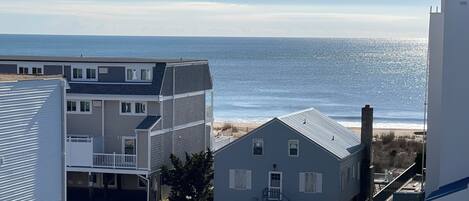 A coastal residential area with houses overlooking the beach.
