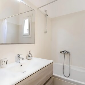 Combined shower/tub, hair dryer, towels, soap