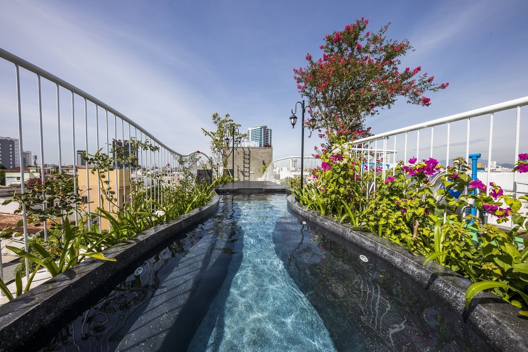 A water slide with a clear view of the cityscape in the background.