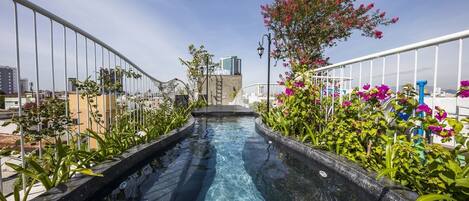 A water slide with a clear view of the cityscape in the background.