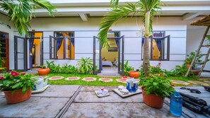 Superior Triple Room, 1 Bedroom | Living area | 32-inch flat-screen TV with cable channels, TV - Hoi An Garden Sea Homestay (Da Nang)