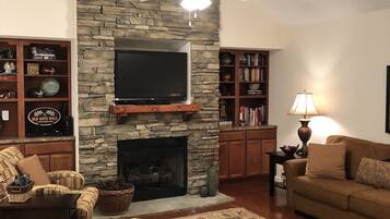 Smart TV, fireplace, books