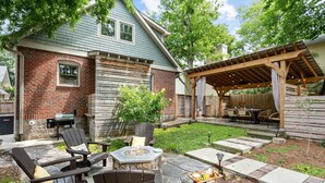 A backyard with a fire pit, outdoor seating, a pergola, and a barbecue area. - PRISTINE PROPERTY IN PRIME LOCATION — CHARMING ☆ SAFE ☆ WALK TO EVERYTHING (Nashville)