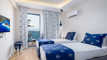 Suíte luxo, 1 quarto, vista para o mar | 1 quarto, roupas de cama premium, frigobar (abastecido com itens grátis)