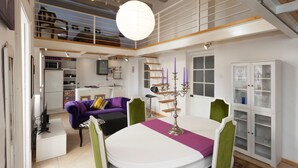 Ein modernes Wohnzimmer mit Essbereich, Treppe und Küche.