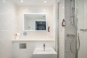 Shower, free toiletries, hair dryer, towels