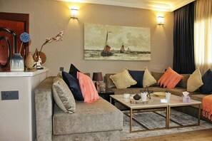 Apartment, 3 Bedrooms | Living area | Flat-screen TV - Résidence Almina (M'diq)