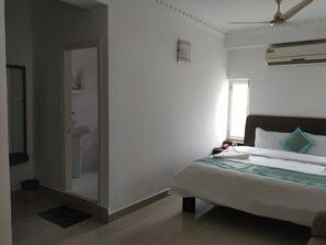 Deluxe Double or Twin Room, 1 Large Twin Bed | Living area | 22-inch LED TV with satellite channels, TV - Aum Hotel (Puttaparti)