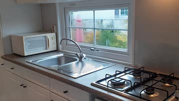 Fridge, stovetop, electric kettle, toaster