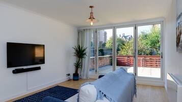 Apartment, 1 King Bed with Sofa bed | Living area | 30-inch TV with digital channels