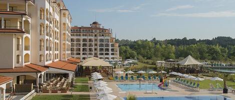 Seasonal outdoor pool, pool umbrellas, pool loungers