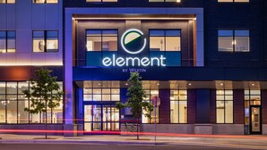 A modern hotel facade with a prominent 'element by Westin' sign, large windows, and a bicycle parked outside. - Element by Marriott Minneapolis Downtown (Minneapolis)